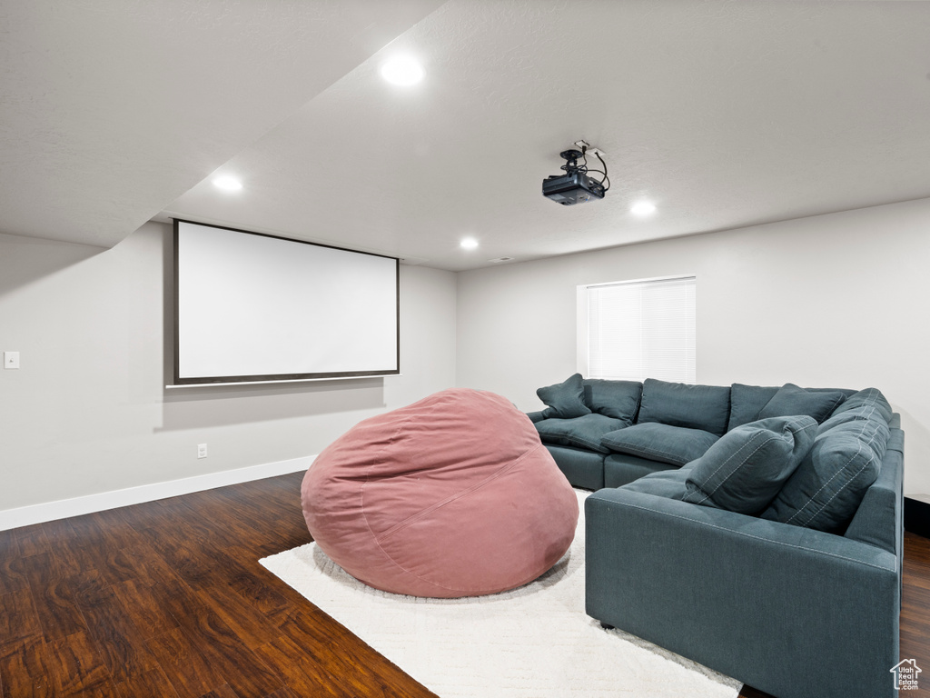 Cinema featuring wood finished floors, baseboards, and recessed lighting