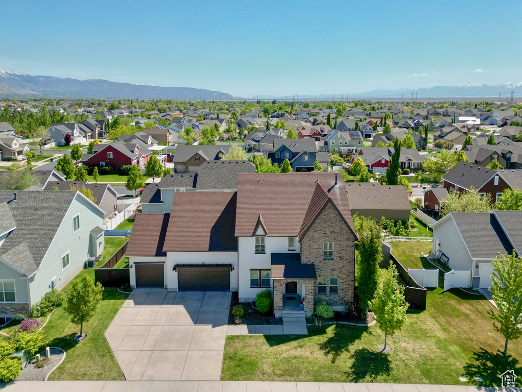 Drone / aerial view with a residential view and a mountain view