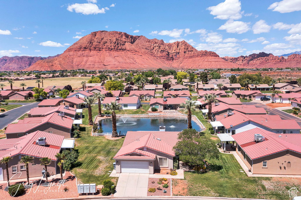 Aerial view of residential area featuring a water and mountain view