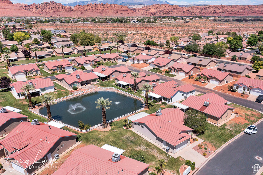 Aerial view of residential area featuring a water and mountain view