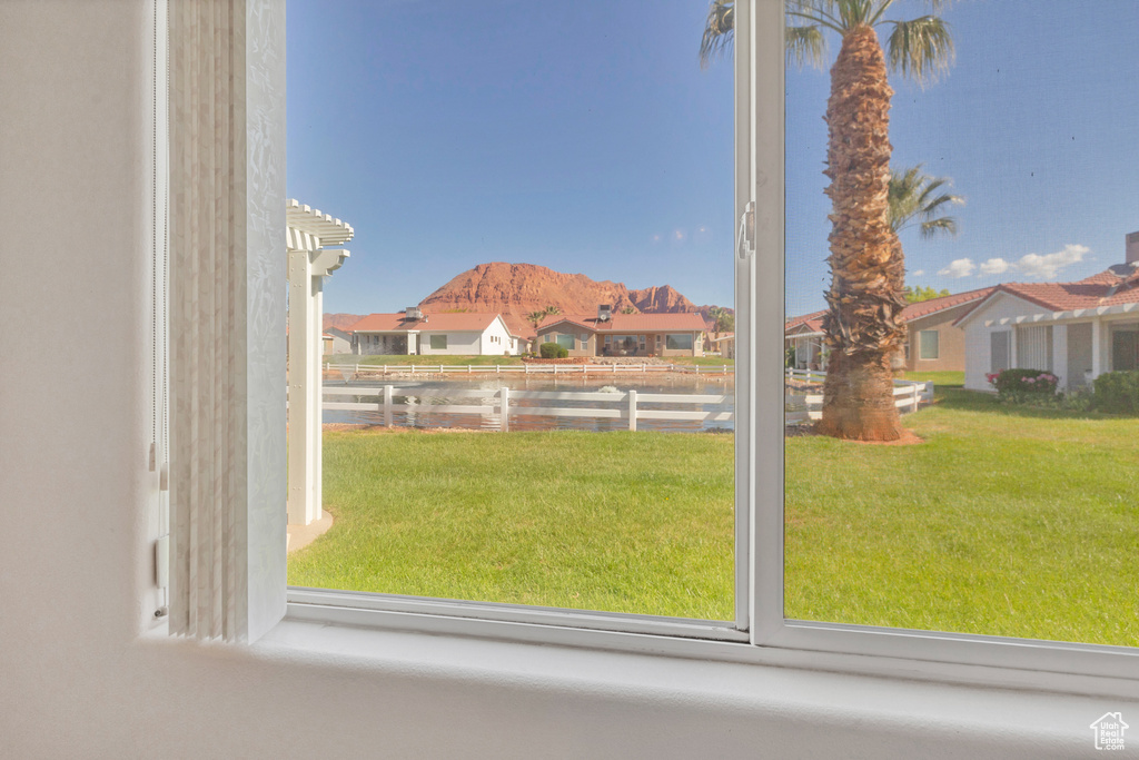 Interior space with a water and mountain view and a residential view