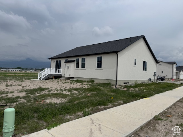 View of front facade with stucco siding