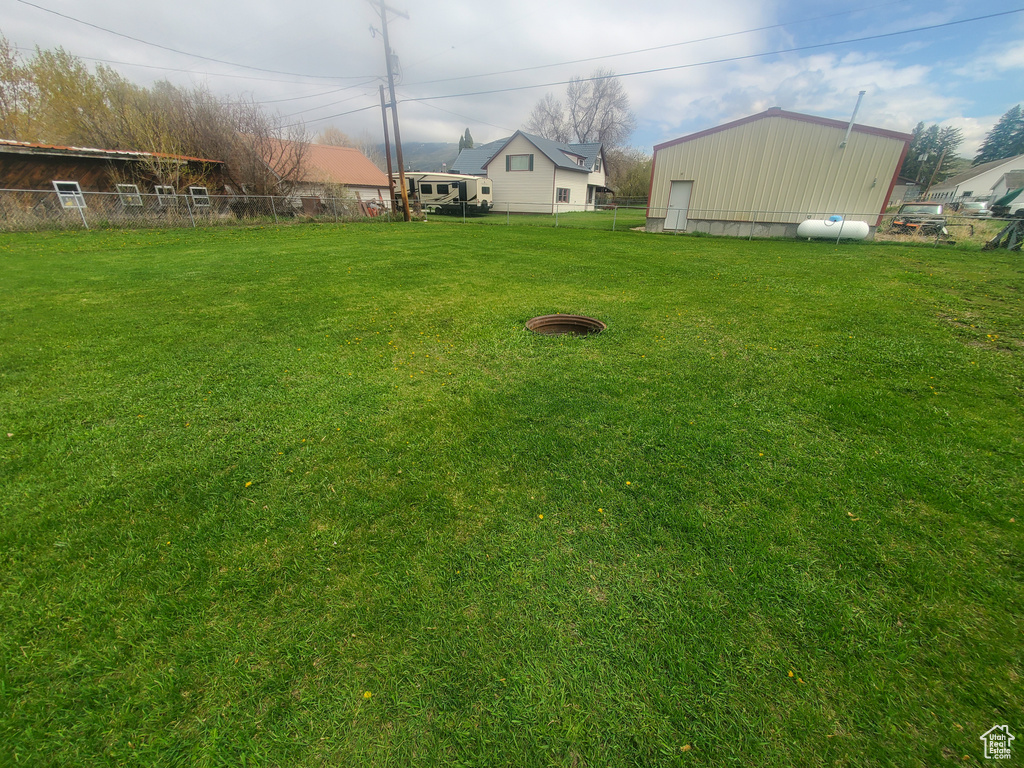 View of yard featuring fence