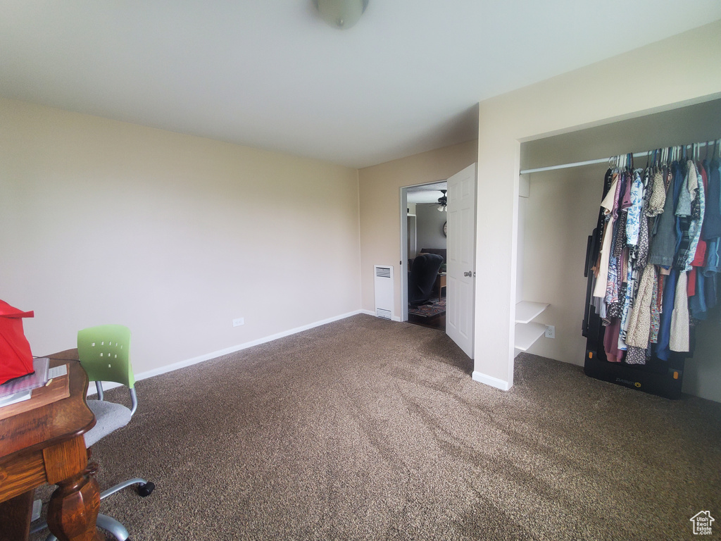 Unfurnished bedroom featuring baseboards, a closet, and carpet floors