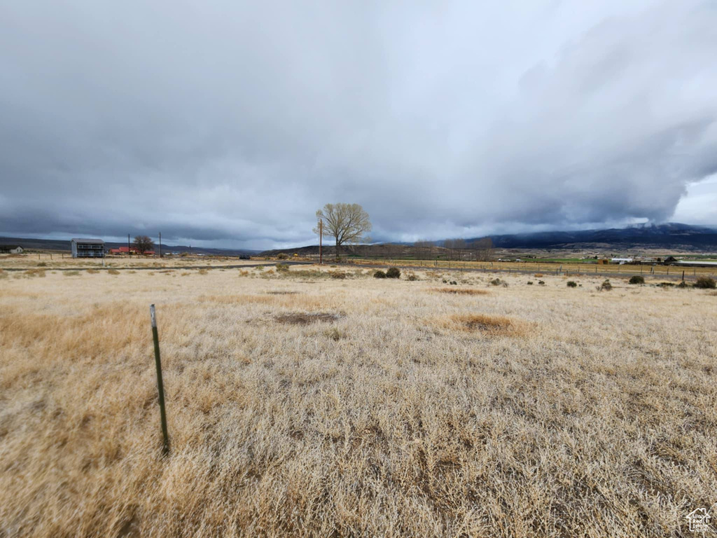 View of yard with a rural view