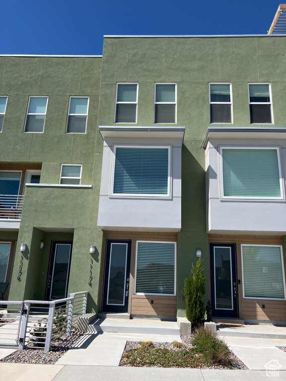 View of property featuring stucco siding