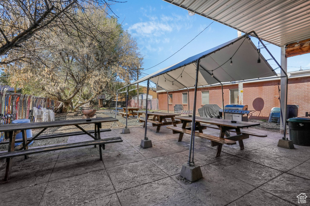 Surrounding community with a trampoline, a patio area, and fence