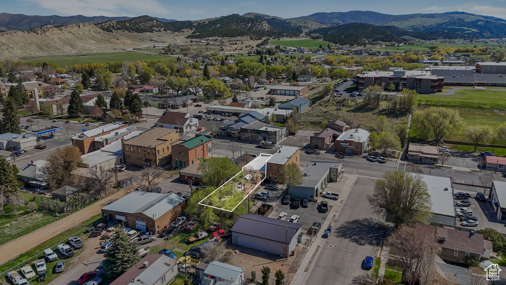 Birds eye view of property with a mountain view