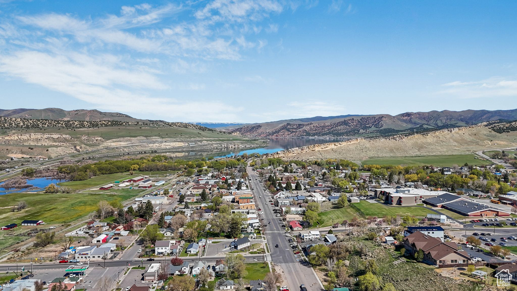 Aerial view featuring a water and mountain view