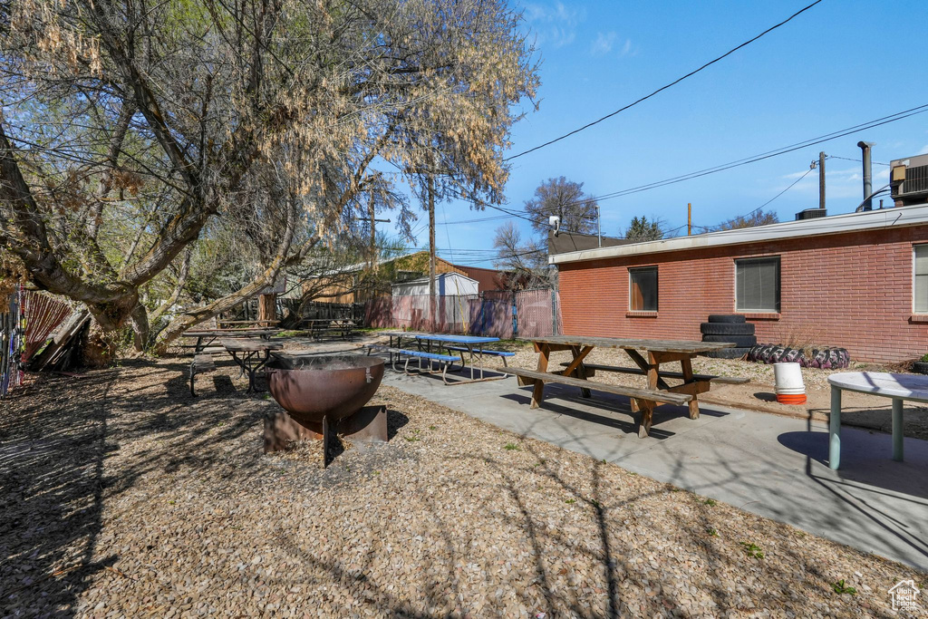 View of yard featuring a patio area and fence