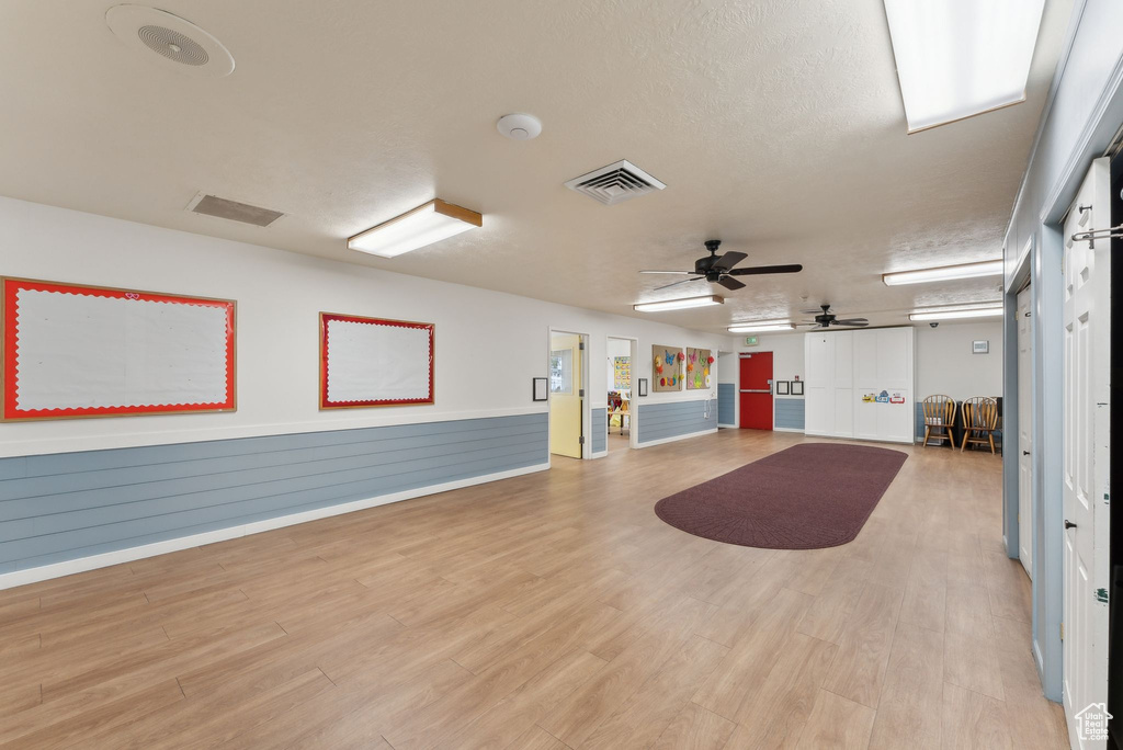 Interior space with visible vents, light wood-style flooring, and ceiling fan