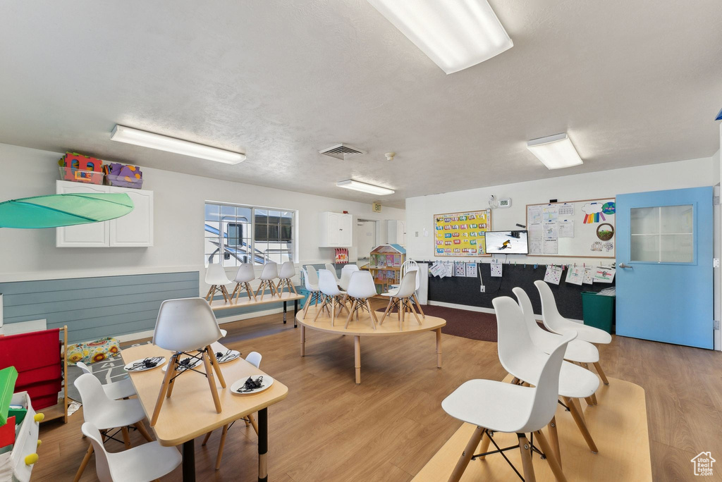 Interior space with light wood finished floors and visible vents