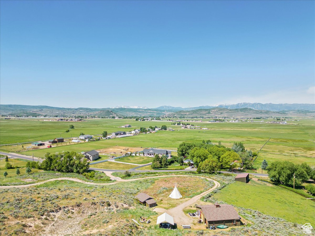 Aerial view featuring a rural view and a mountain view