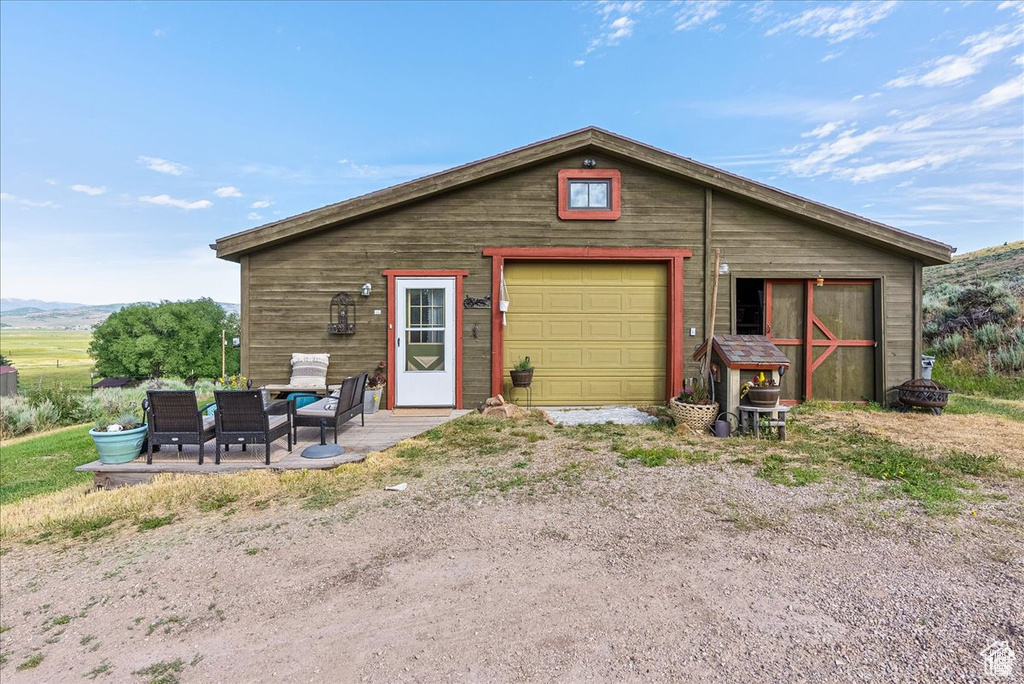 Detached garage featuring a mountain view