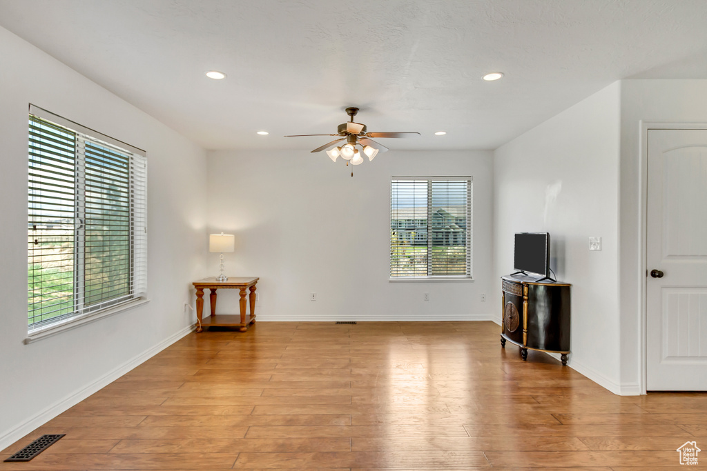 Unfurnished living room featuring recessed lighting, light wood-style floors, and ceiling fan