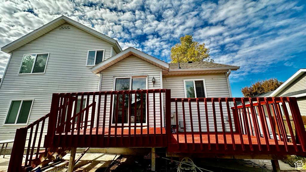 Rear view of house with a wooden deck