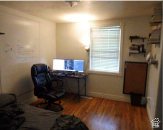 Office featuring baseboards and wood finished floors