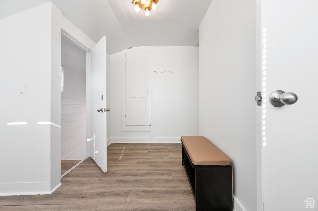 Interior space featuring light wood-style flooring and lofted ceiling