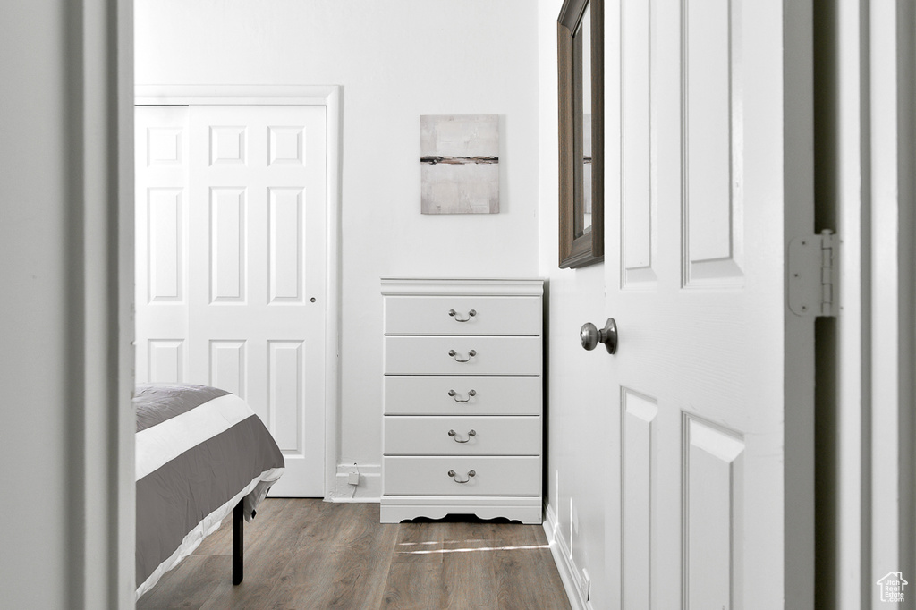 Interior space featuring baseboards and wood finished floors