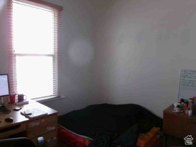 Bedroom with multiple windows
