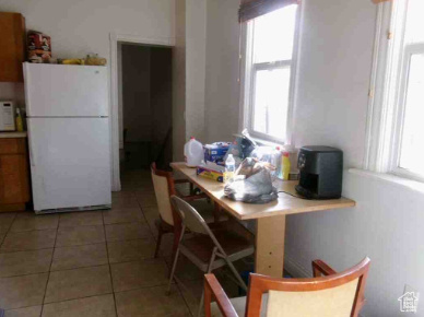 Dining room featuring light tile patterned flooring