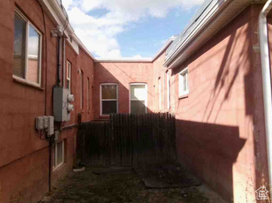 View of property exterior with fence