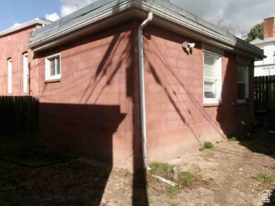View of side of property with fence