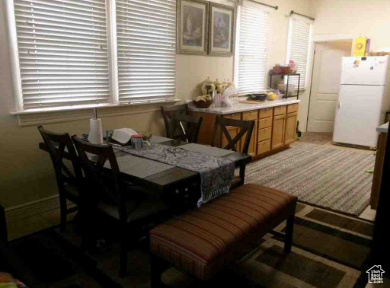 Dining space featuring light colored carpet