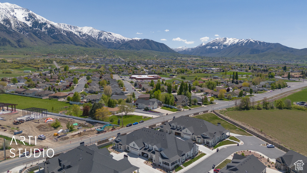 Birds eye view of property with a residential view and a mountain view