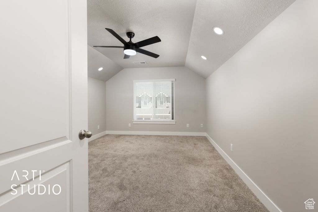 Additional living space featuring recessed lighting, visible vents, lofted ceiling, and carpet floors