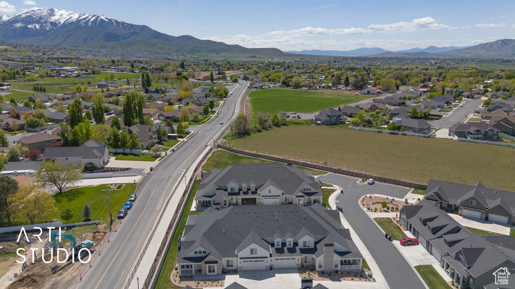 Birds eye view of property with a residential view and a mountain view