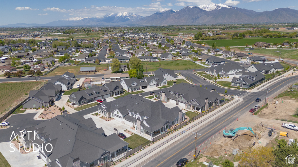 Drone / aerial view featuring a mountain view and a residential view