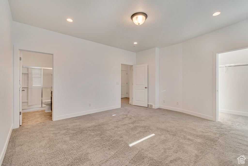 Unfurnished bedroom featuring carpet flooring, baseboards, and recessed lighting