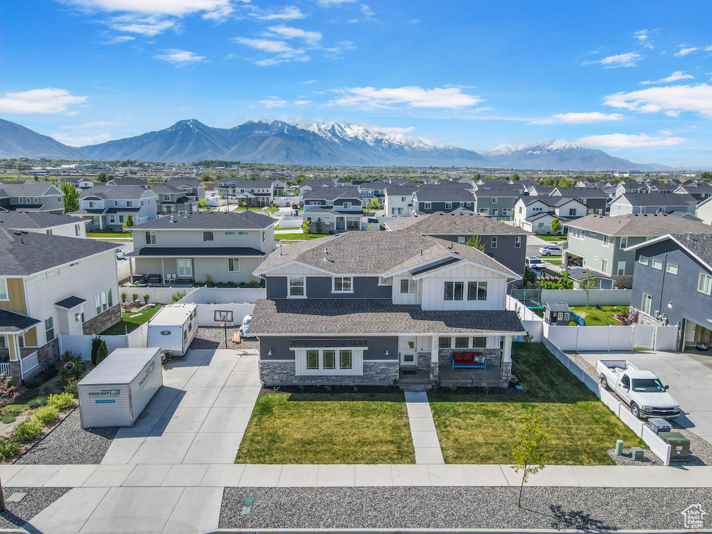 Drone / aerial view featuring a residential view and a mountain view
