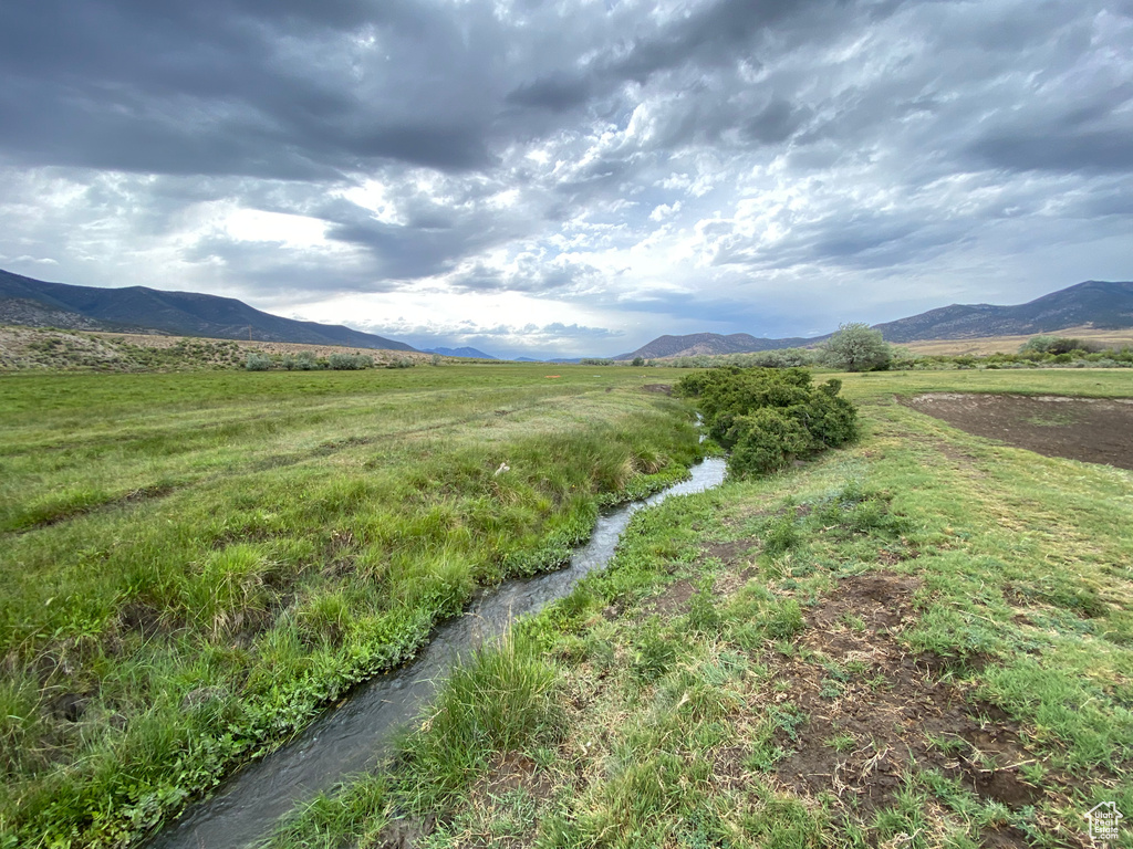 Property view of mountains with a rural view