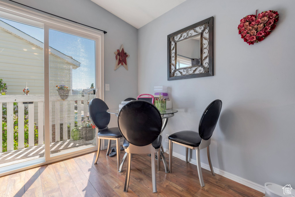 Dining room featuring baseboards and hardwood / wood-style floors