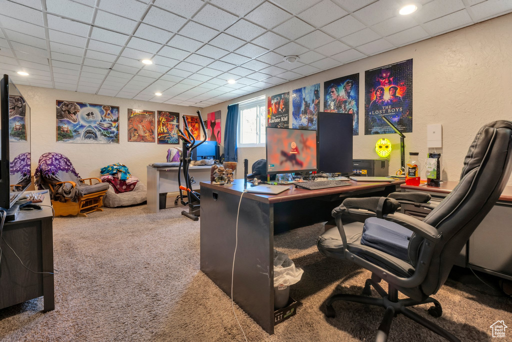 Office area with carpet flooring, recessed lighting, a drop ceiling, and a textured wall