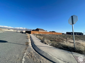 View of street with traffic signs, curbs, and sidewalks