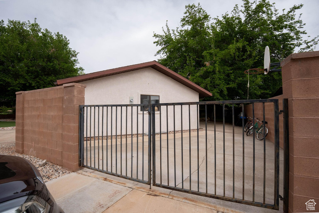 View of gate featuring fence