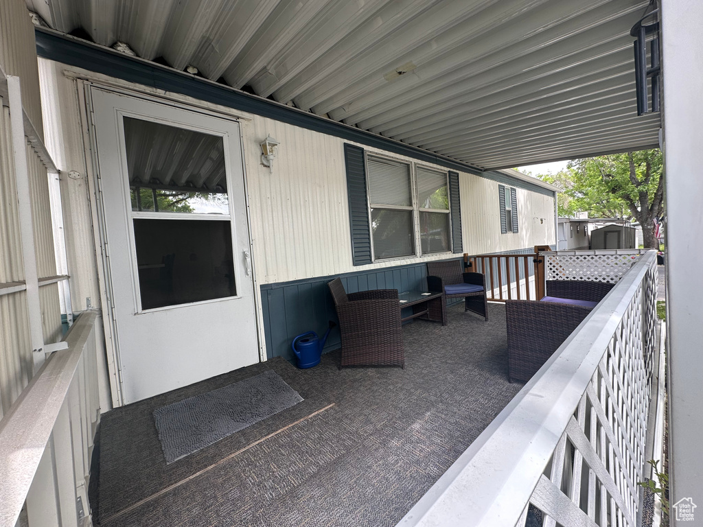 View of patio featuring a shed