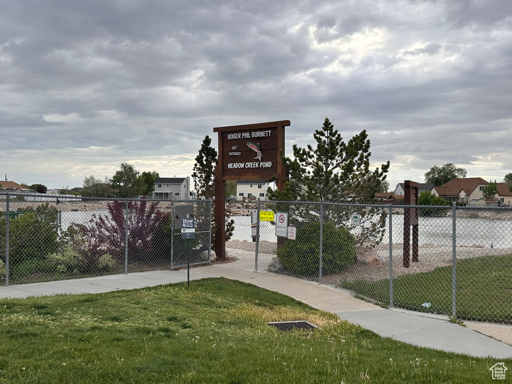 Surrounding community featuring fence and a lawn
