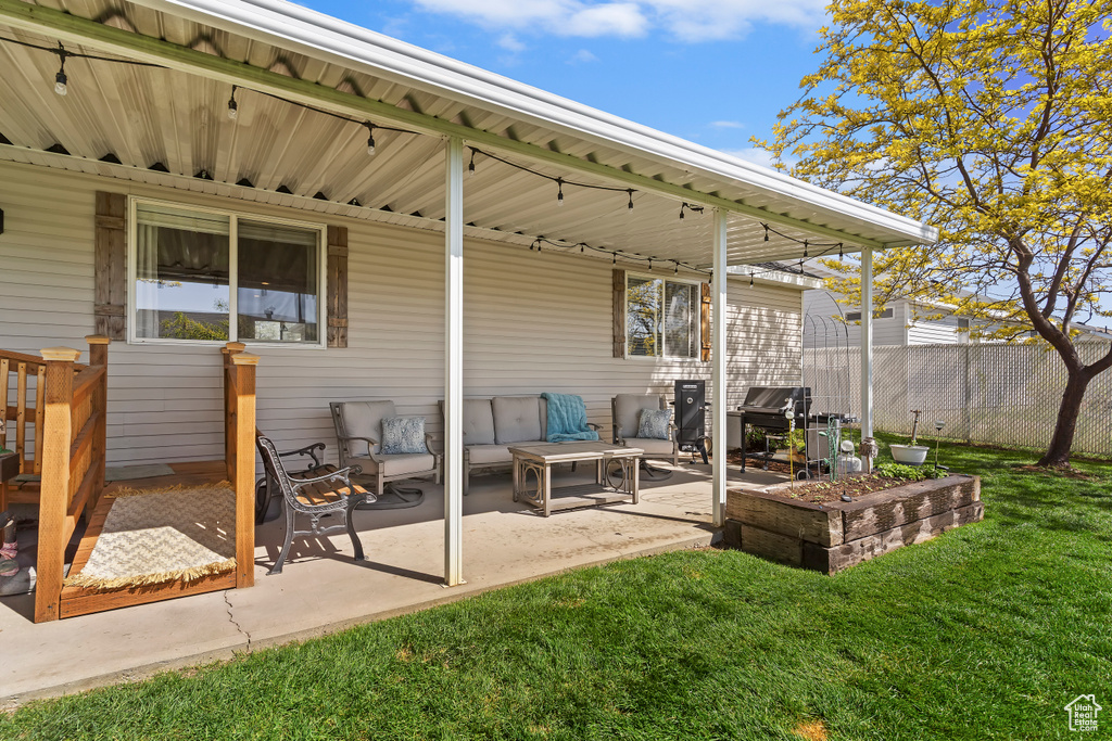 View of patio featuring fence
