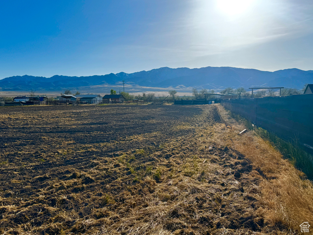 Property view of mountains with a rural view