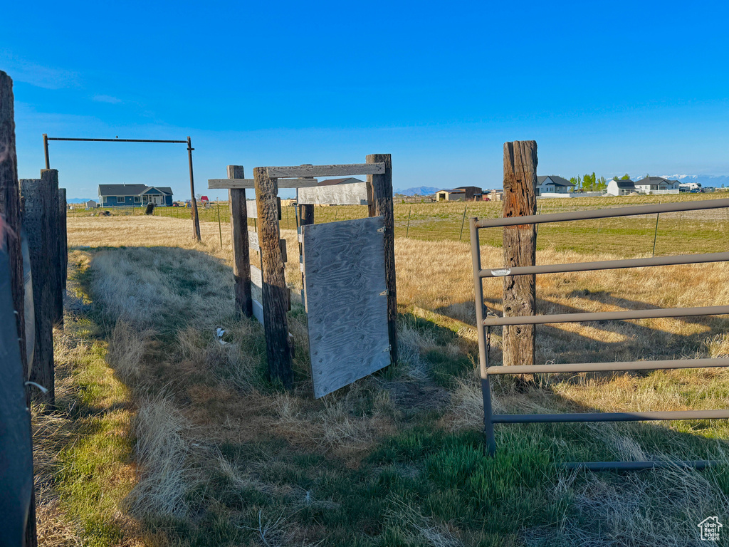 View of gate featuring a rural view and fence