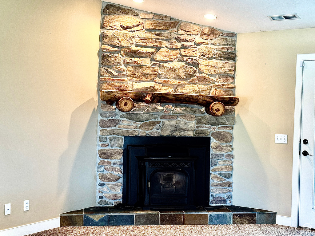 Interior details featuring carpet floors, baseboards, and visible vents