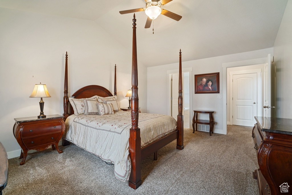 Carpeted bedroom with baseboards, ceiling fan, and lofted ceiling