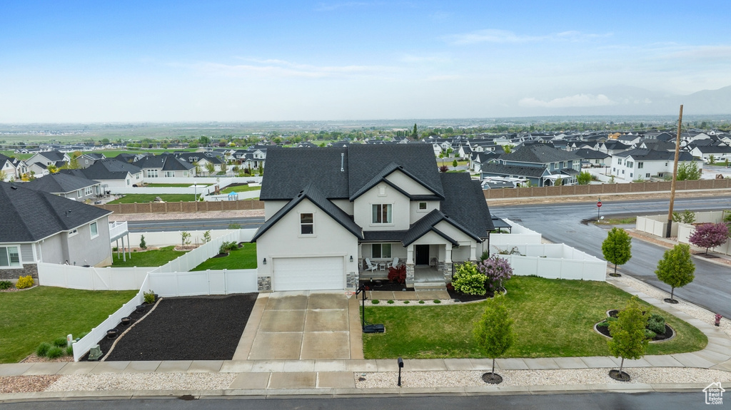 Exterior space featuring a residential view, fence private yard, and stucco siding