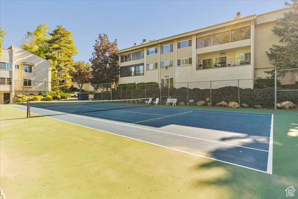 View of tennis court with fence