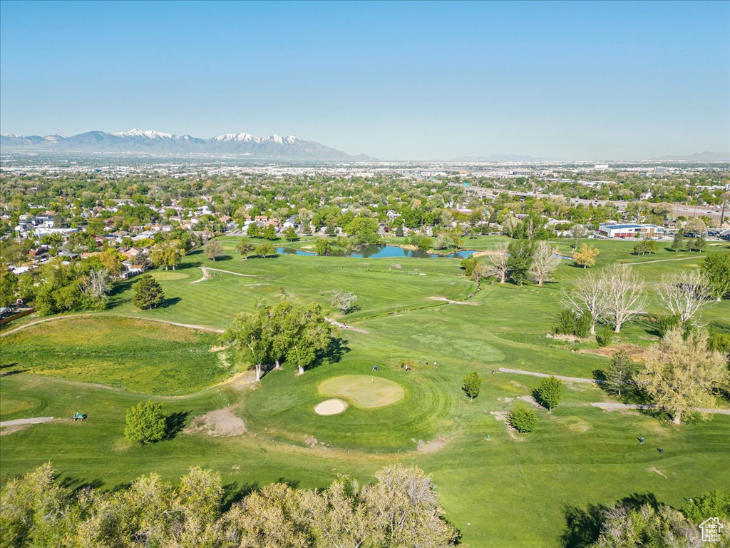 Birds eye view of property featuring a water and mountain view and golf course view