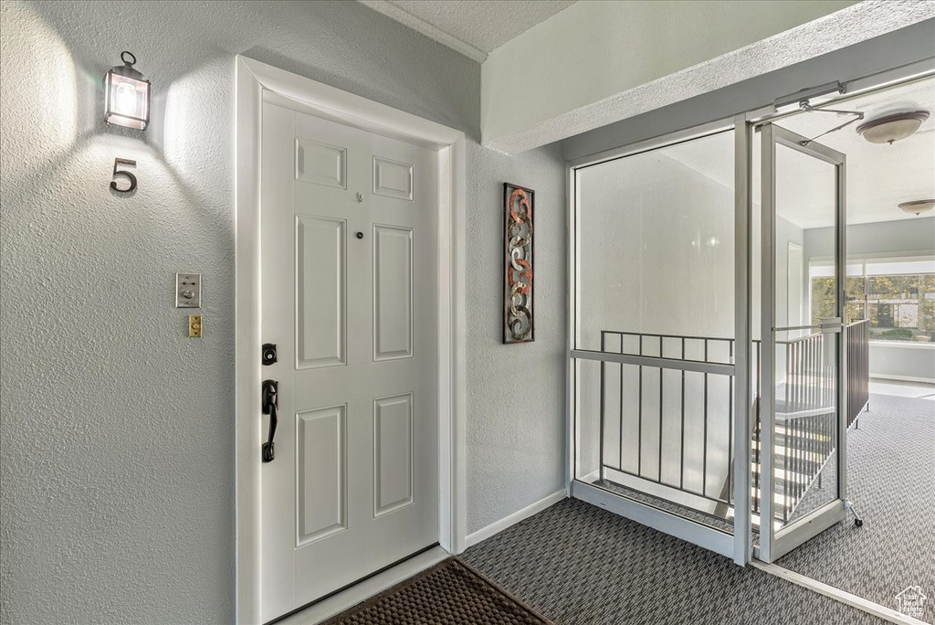 Doorway to property with covered porch